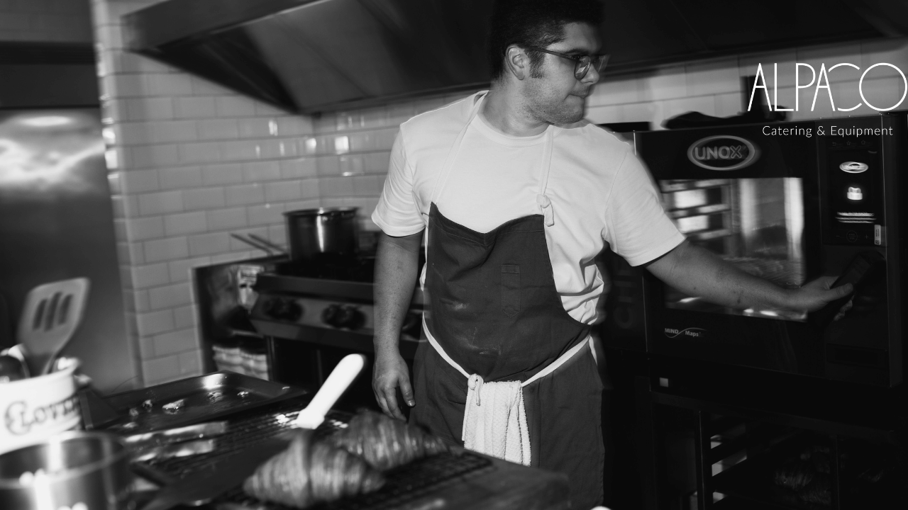 A chef operates a UNOX combi oven in a professional kitchen — showcasing Alpaco’s advanced catering equipment for restaurants and commercial kitchens.